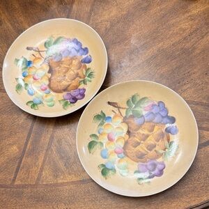 Pair of vintage wall porcelain plates featuring a hand-painted fruit motif